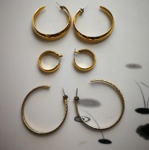 3 pairs of golden tone earrings